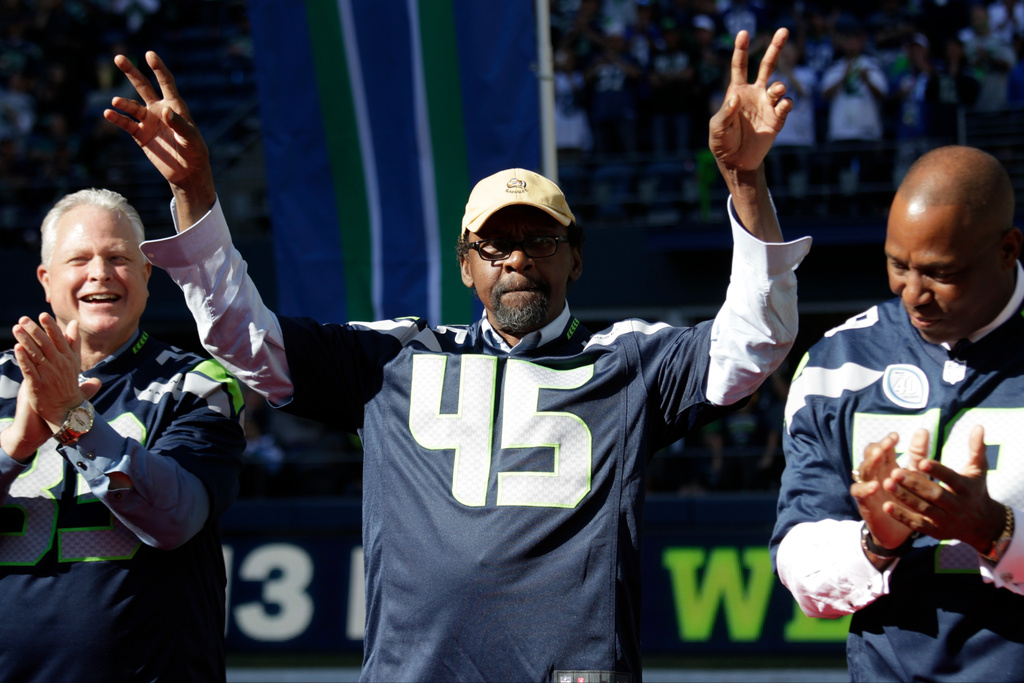 FILE - In this Sept. 27, 2015, former Seattle Seahawks' Kenny Easley (45) is recognized during a halftime celebration of the 40th anniversary of the team during an NFL football game against the Chicago Bears in Seattle..(AP Photo/John Froschauer, File)