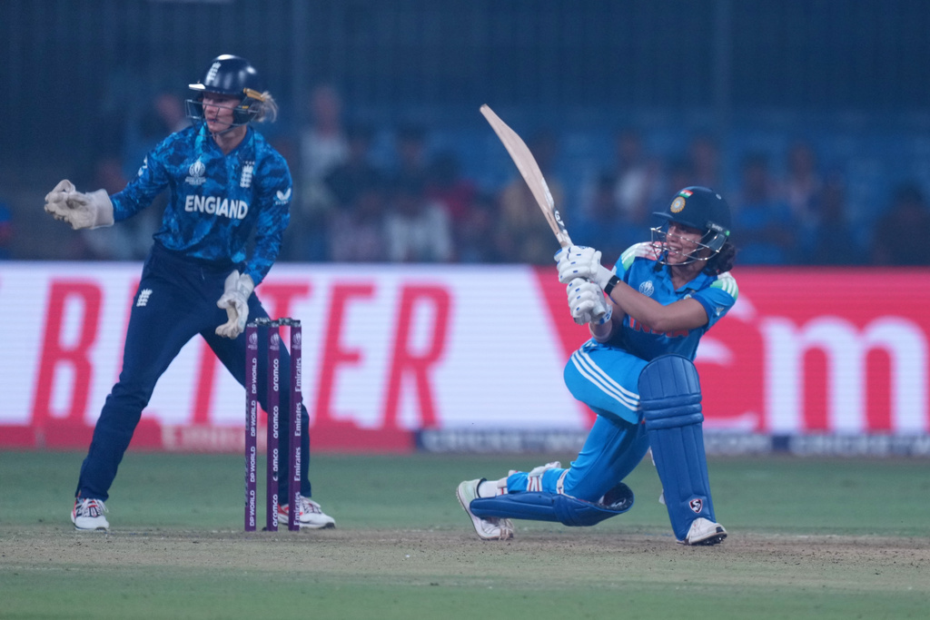 India's Smriti Mandhana plays a shot during the ICC Women's Cricket World Cup match between India and England in Indore, India, Sunday, Oct. 19, 2025. (AP Photo/Ajit Solanki)
