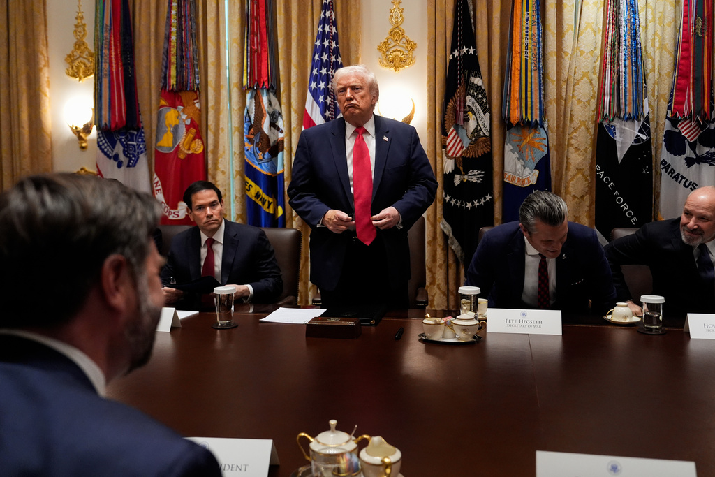 President Donald Trump stands up to depart following a Cabinet meeting at the White House, Tuesday, Dec. 2, 2025, in Washington. (AP Photo/Julia Demaree Nikhinson)