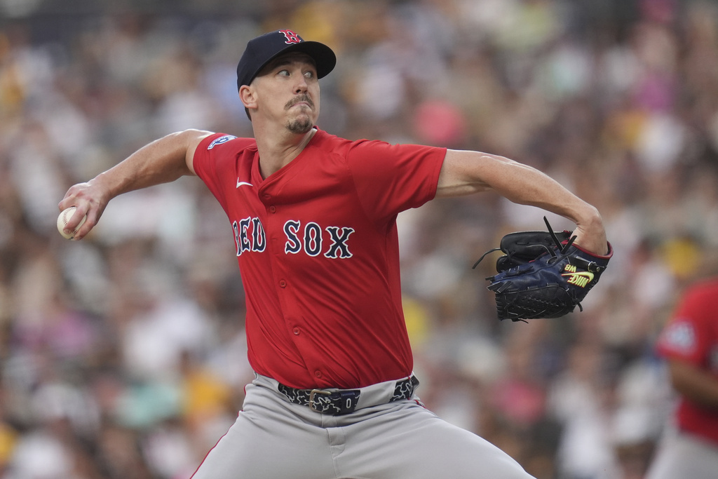 Boston Red Sox starting pitcher Walker Buehler works against a San Diego Padres batter during the first inning of a baseball game Friday, Aug. 8, 2025, in San Diego. (AP Photo/Gregory Bull)