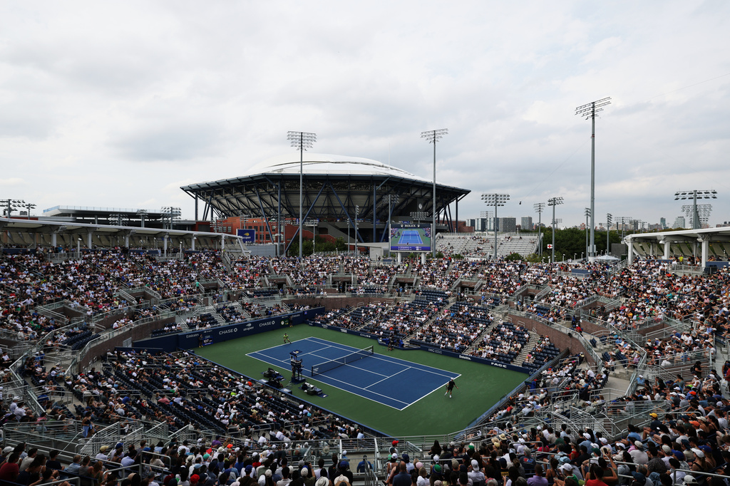 Tennis fans watch a match between Miomir Kecmanovic, of Serbia, and Denis Shapovalov, of Canada, during the first round of the U.S. Open tennis championships, Sunday, Aug. 30, 2026, in New York. (AP Photo/Adam Hunger)