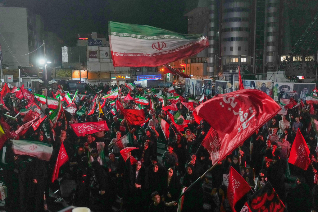 Pro-government demonstrators gather at a square in Tehran, Friday, July 17, 2026. (AP Photo/Vahid Salemi)
