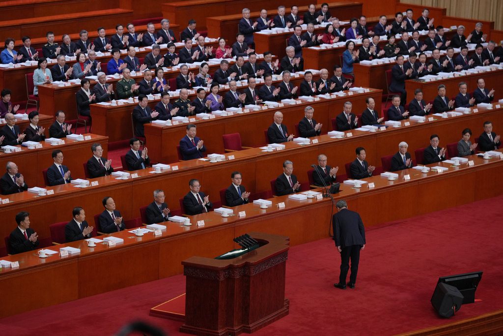 Chinese Premier Li Qiang bows before delivering his report during the opening session of the National People's Congress (NPC) in Beijing, Thursday, March 5, 2026. (AP Photo/Andy Wong)