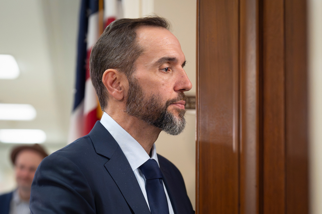Former Department of Justice Special Counsel Jack Smith enters a room in the Rayburn House Office Building to give his deposition before the House Judiciary Committee, part of its oversight into DOJ investigations into President Donald Trump, on Capitol Hill in Washington, Wednesday, Dec. 17, 2025. (AP Photo/J. Scott Applewhite)