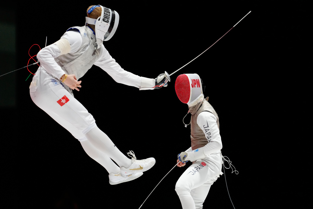 Cheung Ka Long of Hong Kong, left, competes against Shunsuke Baba of Japan in the men's foil team fencing final at the Asian Games in Tokoname, Japan, Friday, Sept. 25, 2026. (AP Photo/Eugene Hoshiko)