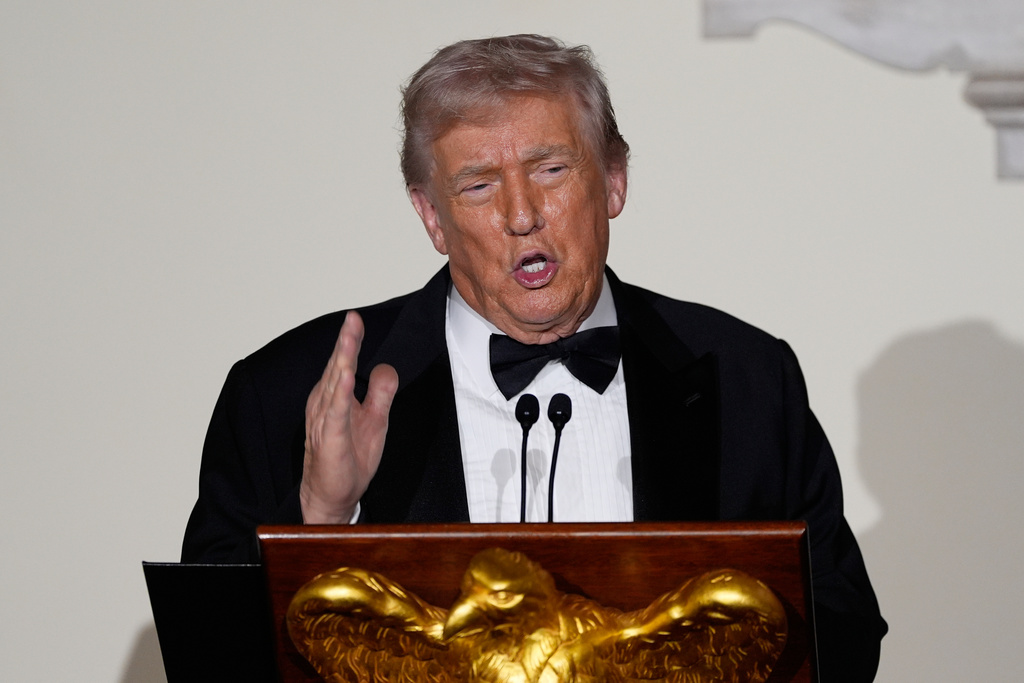 President Donald Trump speaks to guests in the Grand Foyer of the White House during the Congressional Ball, Thursday, Dec. 11, 2025, in Washington. (AP Photo/Alex Brandon)