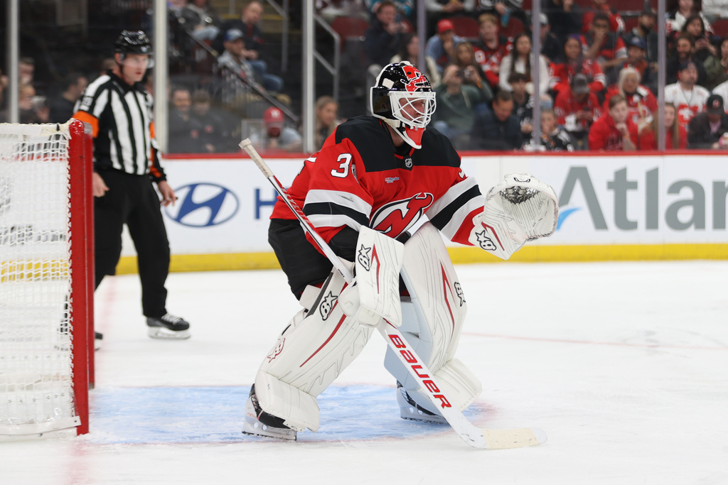 New Jersey Devils goaltender Jake Allen stands in the goal during the first period of an NHL hockey game against the Colorado Avalanche Sunday, Oct. 26, 2025, in Newark, N.J. (AP Photo/Pamela Smith)