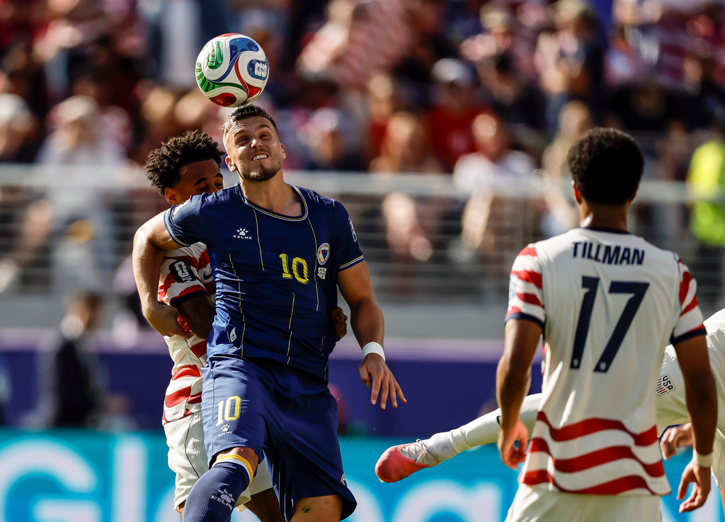 Bosnia and Herzegovina's Ermedin Demirovic (10) heads the ball in the first half of a 2026 FIFA World Cup Round of 32 match against the United States at Levi's Stadium in Santa Clara, Calif., near San Francisco, Wednesday, July 1, 2026. (Carlos Avila Gonzalez/San Francisco Chronicle via AP)