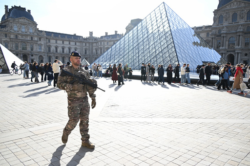 A soldier patrols in courtyard of the Louvre museum, Thursday, Oct. 30, 2025 in Paris. (AP Photo/Emma Da Silva) A soldier patrols in courtyard of the Louvre museum, Thursday, Oct. 30, 2025 in Paris. (AP Photo/Emma Da Silva)