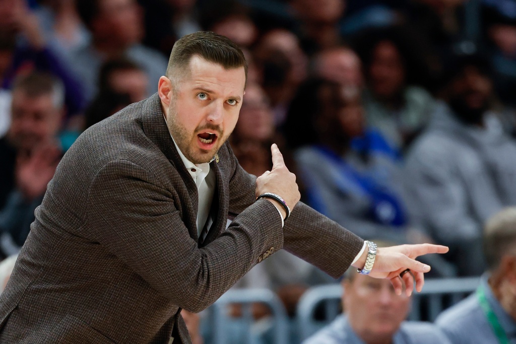 Florida State head coach Luke Loucks directs his team during the first half of an NCAA college basketball game against Duke in the quarterfinals of the Atlantic Coast Conference tournament in Charlotte, N.C., Thursday, March 12, 2026. (AP Photo/Nell Redmond)