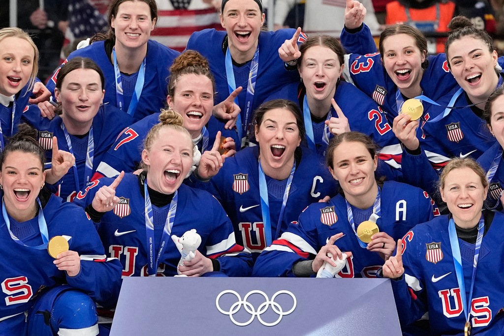 United States' team celebrate after victory ceremony for women's ice hockey at the 2026 Winter Olympics, in Milan, Italy, Thursday, Feb. 19, 2026. (AP Photo/Hassan Ammar)