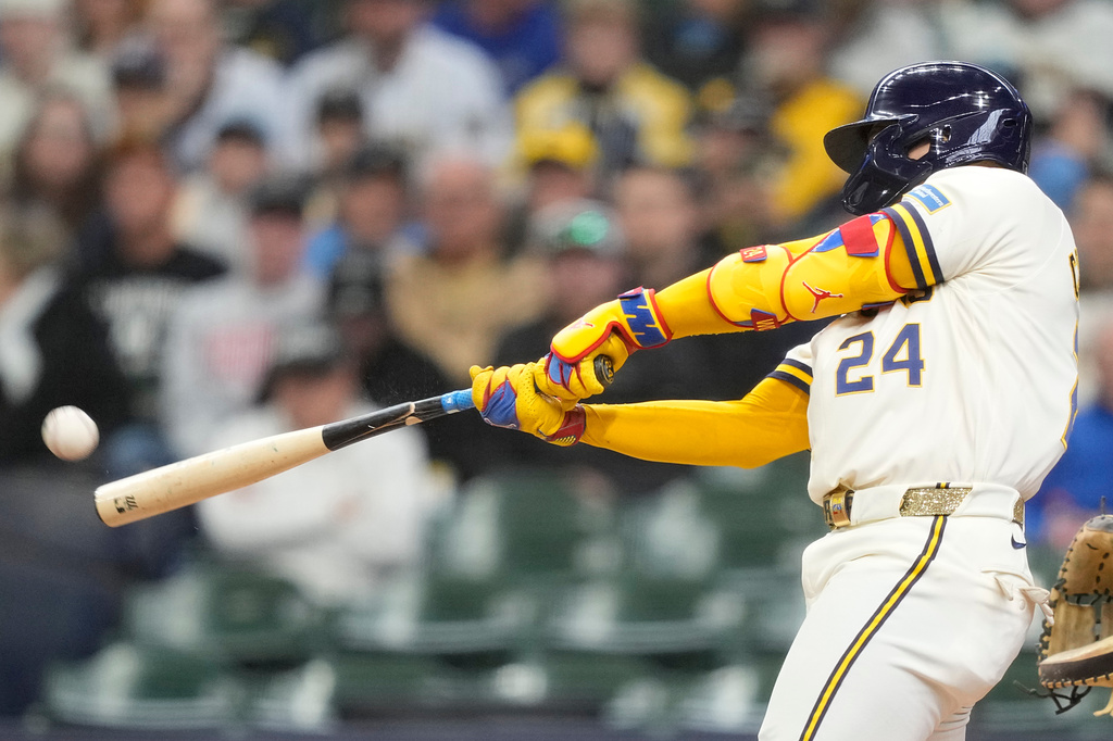 Milwaukee Brewers' William Contreras hits an RBI double during the first inning of a baseball game against the Arizona Diamondbacks, Thursday, April 30, 2026, in Milwaukee. (AP Photo/Kayla Wolf)
