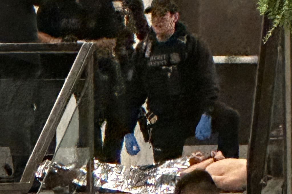 Members of law enforcement control shooting suspect Cole Tomas Allen during the White House Correspondents Dinner, Saturday, April 25, 2026, in Washington. (AP Photo/Alex Brandon)