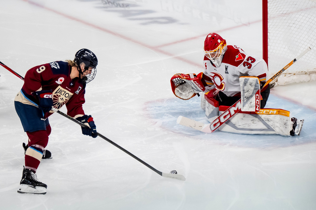 Montreal Victoire's Kati Tabin (9) scores on Ottawa Charge goaltender Gwyneth Philips (33) during the second period in Game 2 of the PWHL Walter Cup finals hockey series in Laval, Quebec, Saturday, May 16, 2026.(Christopher Katsarov/The Canadian Press via AP)