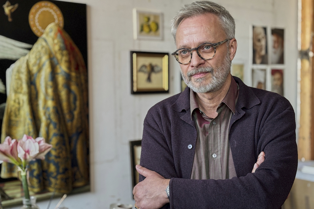 Painter Michael Triegel poses for photos during an interview with The Associated Press at his studio in Leipzig, Germany, Tuesday, Dec. 2, 2025. (AP Photo/Pietro De Cristofaro)