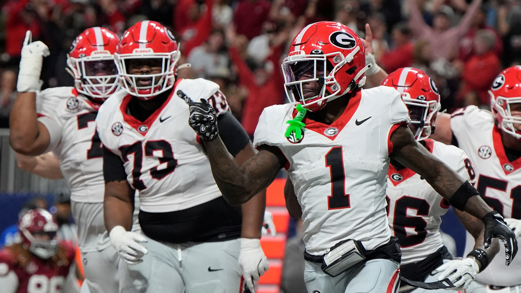 Georgia wide receiver Zachariah Branch (1) celebrates his touchdown against Alabama during the second half of a Southeastern Conference championship NCAA college football game, Saturday, Dec. 6, 2025, in Atlanta. (AP Photo/Mike Stewart)
