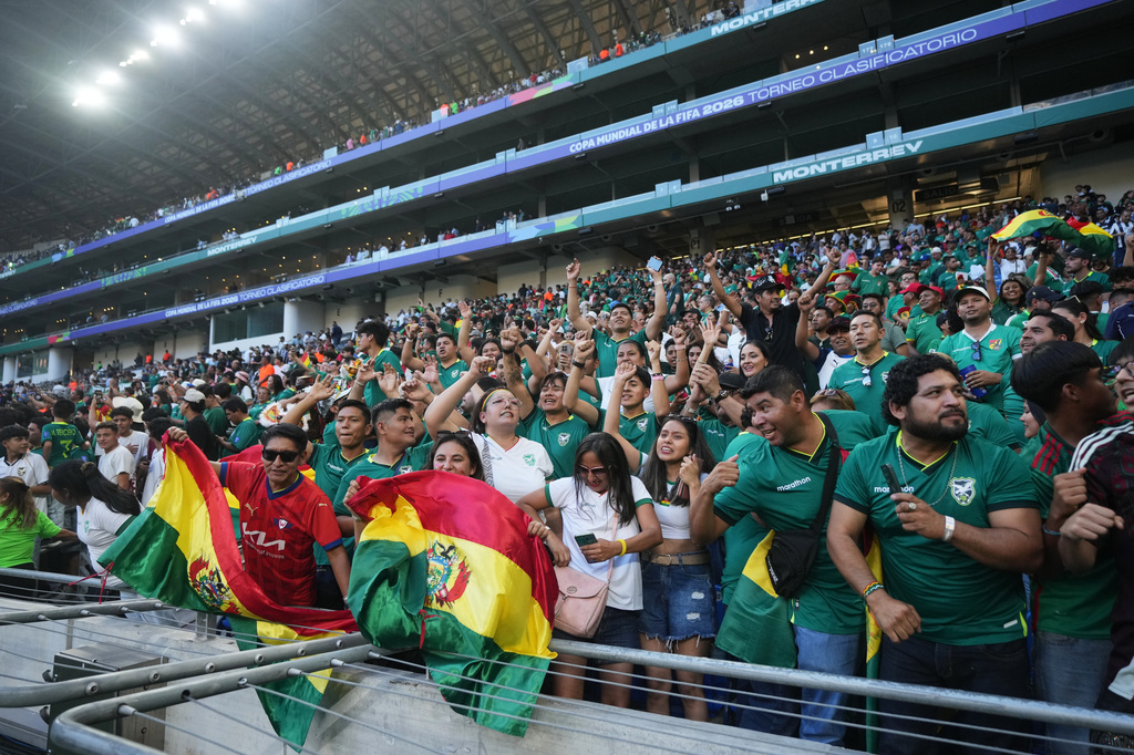 Bolivia fans celebrate after a World Cup playoff semifinal soccer match between Bolivia and Suriname in Monterrey, Mexico, Thursday, March 26, 2026. (AP Photo/Fernando Llano)