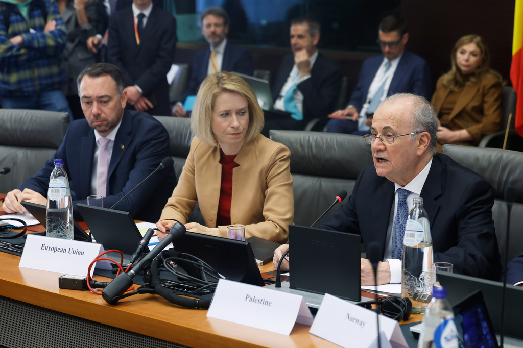 European Union foreign policy chief Kaja Kallas, center, listens as Palestinian Prime Minister Mohammad Mustafa, right, speaks during a meeting of the Global Alliance for the Implementation of the Two-State Solution in Brussels, Monday, April 20, 2026. (AP Photo/Geert Vanden Wijngaert)