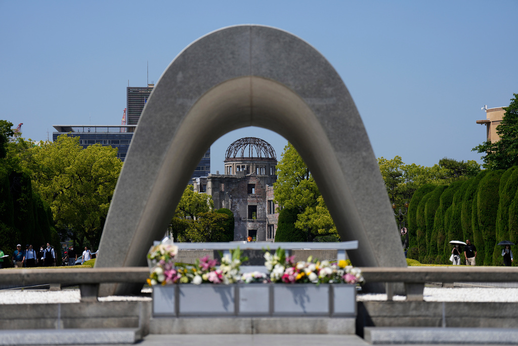 FILE - The famed Atomic Bomb Dome is seen through the cenotaph dedicated to the victims of the atomic bombing, at the Hiroshima Peace Memorial Park in Hiroshima, western Japan, Wednesday, May 17, 2023. (AP Photo/Hiro Komae, File)