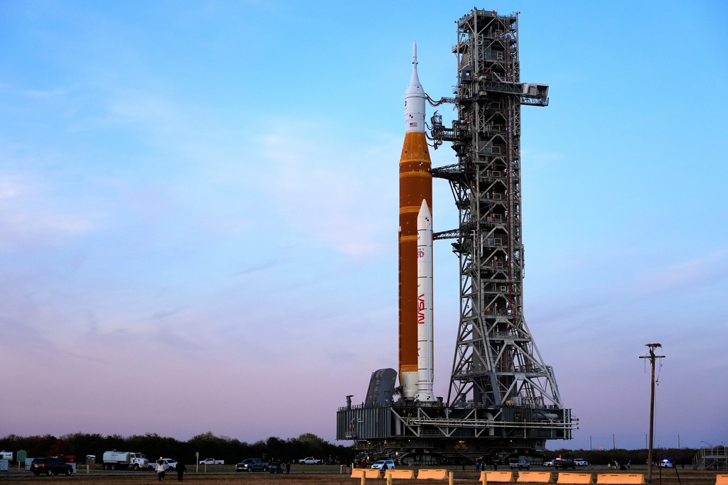 NASA's Artemis II SLS (Space Launch System) moon rocket with the Orion spacecraft slowly rolls back towards the Vehicle Assembly Building at the Kennedy Space Center, Wednesday, Feb. 25, 2026, in Cape Canaveral, Fla. (AP Photo/John Raoux)