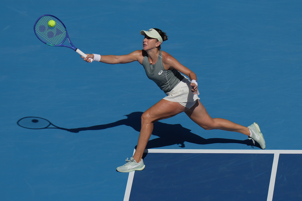 Belinda Bencic, of Switzerland plays a forehand return to Coco Gauff, of the United States during the women's singles match of the China Open tennis tournament, in Beijing, Tuesday, Sept. 30, 2025. (AP Photo/Andy Wong)