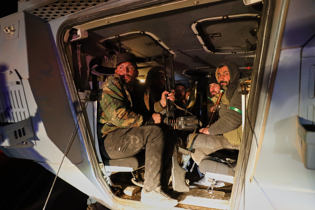 Syrian government forces take over the Achrafieh neighborhood from Kurdish fighters during ongoing clashes that erupted Tuesday in a contested area of the northern city of Aleppo, Syria, Thursday, Jan. 8, 2026. (AP Photo/Omar Albam)