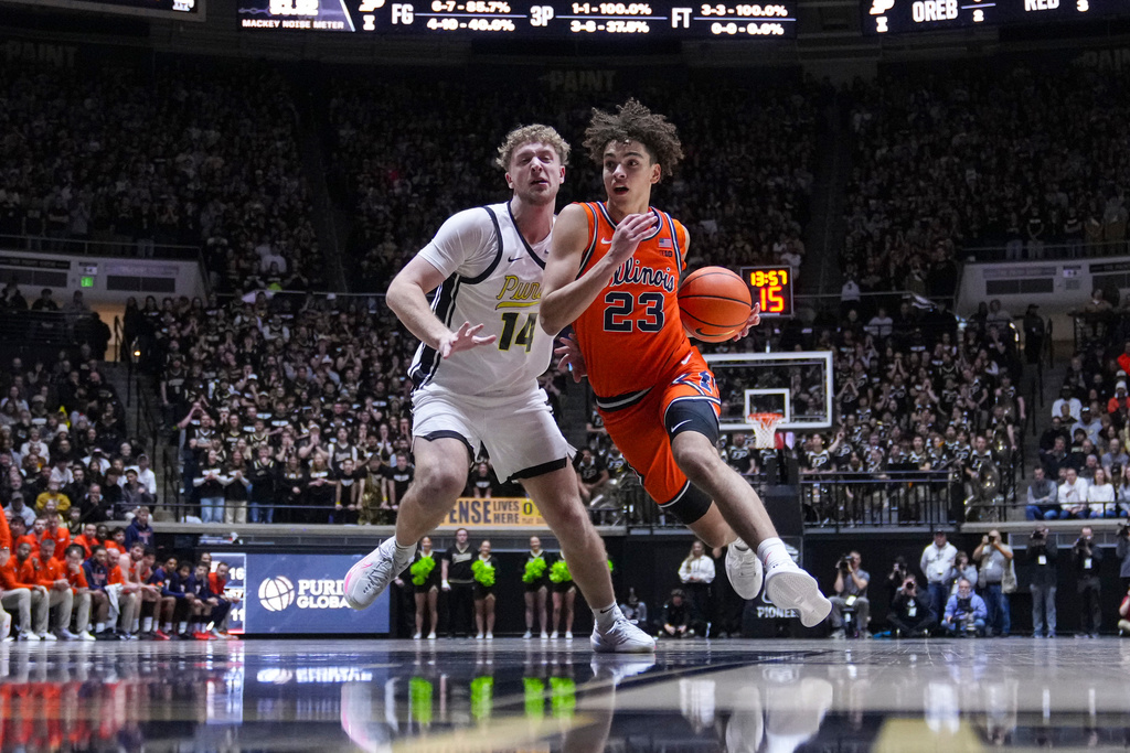 Illinois guard Keaton Wagler (23) drives on Purdue guard Jack Benter (14) during the first half of an NCAA college basketball game in West Lafayette, Ind., Saturday, Jan. 24, 2026. (AP Photo/Michael Conroy)