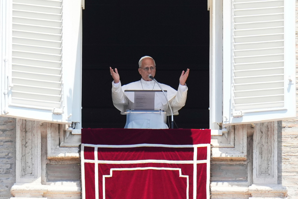 Pope Leo XIV delivers his blessing during the Angelus noon prayer from the window of his studio overlooking St.Peter's Square, at the Vatican, Sunday, June 28, 2026. (AP Photo/Alessandra Tarantino)