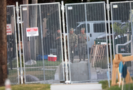Members of the Texas National Guard stand outside the Immigration and Customs Enforcement (ICE) processing facility in Broadview, Ill. on Thursday, Oct. 9, 2025. (AP Photo/Talia Sprague) Members of the Texas National Guard stand outside the Immigration and Customs Enforcement (ICE) processing facility in Broadview, Ill. on Thursday, Oct. 9, 2025. (AP Photo/Talia Sprague)