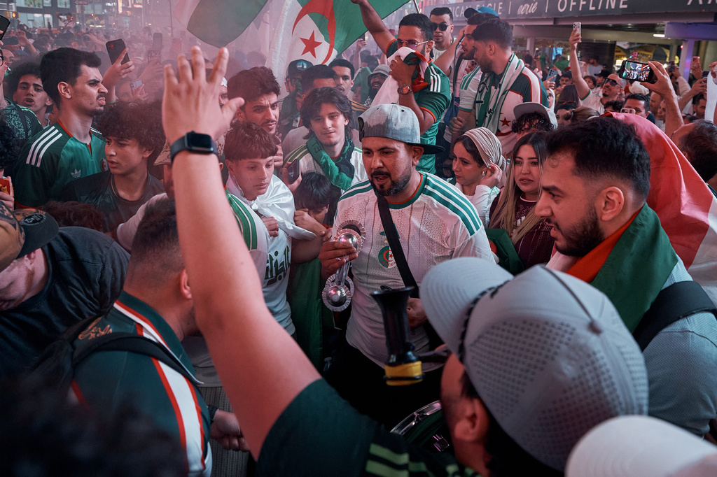 Algerian fans take part in a pre-match rally in support of the Algerian national soccer team in Times Square, Monday, June 15, 2026, in New York. (AP Photo/Andres Kudacki)