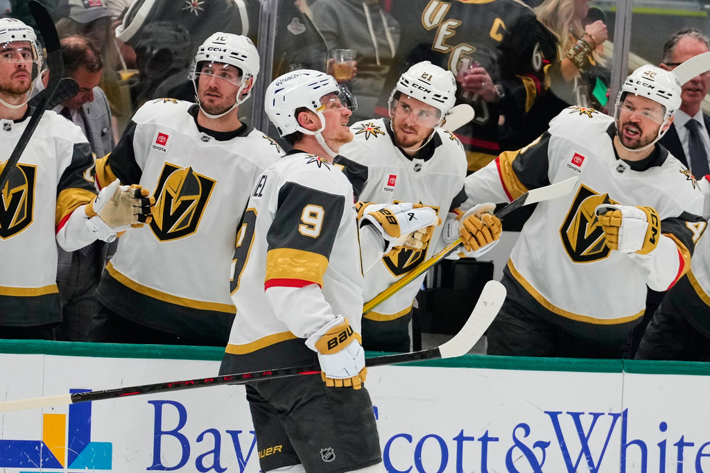 Vegas Golden Knights center Jack Eichel (9) celebrates with the team after scoring in the second period of an NHL hockey game against the Dallas Stars in Dallas, Tuesday, March 10, 2026. (AP Photo/Tony Gutierrez)