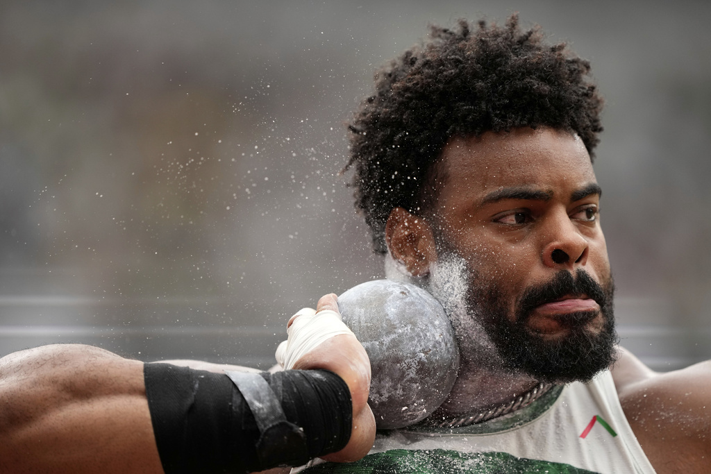 Nigeria's Chukwuebuka Cornnell Enekwechi makes an attempt in the men's shot put qualification at the World Athletics Championships in Tokyo, Saturday, Sept. 13, 2025. (AP Photo/Matthias Schrader)