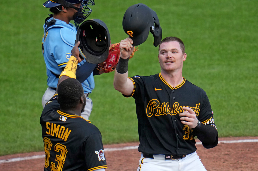 Pittsburgh Pirates' Henry Davis, right, celebrates with Ronny Simon (63) after hitting a two-run home run in the eighth inning of a baseball game against the Milwaukee Brewers in Pittsburgh, Thursday, Sept. 17, 2026. (AP Photo/Gene J. Puskar)