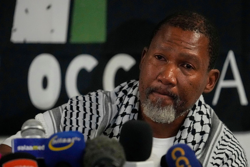 Mandla Mandela speaks to journalists after their arrival with members of the Global Sumud Flotilla, at OR Tambo International Airport, in Johannesburg, South Africa, Wednesday, Oct. 8, 2025. (AP Photo/Themba Hadebe) Mandla Mandela speaks to journalists after their arrival with members of the Global Sumud Flotilla, at OR Tambo International Airport, in Johannesburg, South Africa, Wednesday, Oct. 8, 2025. (AP Photo/Themba Hadebe)