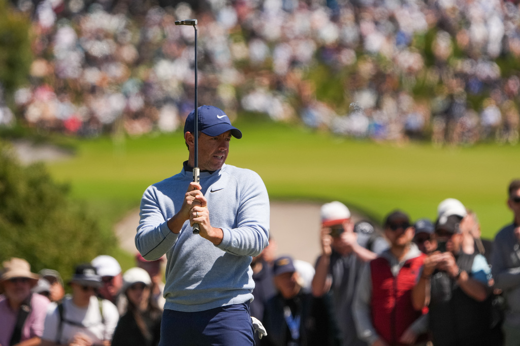 Rory McIlroy, of Northern Ireland, reacts after putting on the fourth hole during the fourth round of the Australian Open golf tournament in Melbourne, Australia, Sunday, Dec. 7, 2025. (AP Photo/Asanka Brendon Ratnayake)