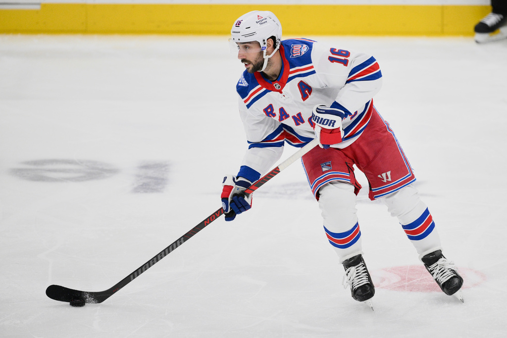 New York Rangers center Vincent Trocheck (16) skates with the puck during the third period of an NHL hockey game against the Washington Capitals, Wednesday, Dec. 31, 2025, in Washington. (AP Photo/Nick Wass)