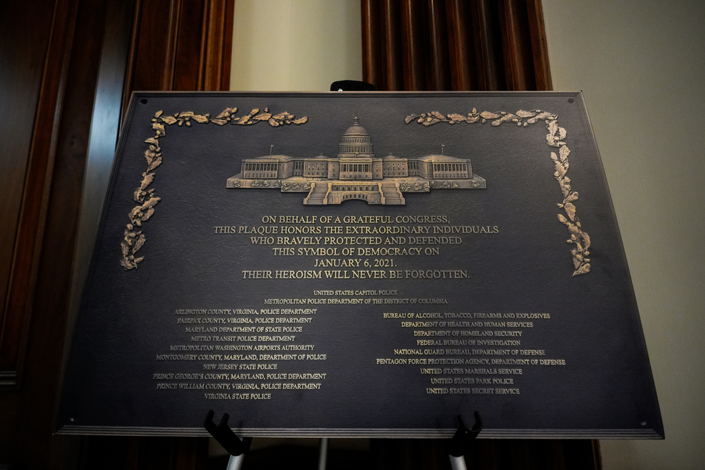 A replica plaque commemorating the Jan. 6, 2021 Capitol riot stands outside the office of House Minority Leader Hakeem Jeffries, D-N.Y, Tuesday, Dec. 30, 2025, at the U.S. Capitol in Washington. (AP Photo/Julia Demaree Nikhinson)
