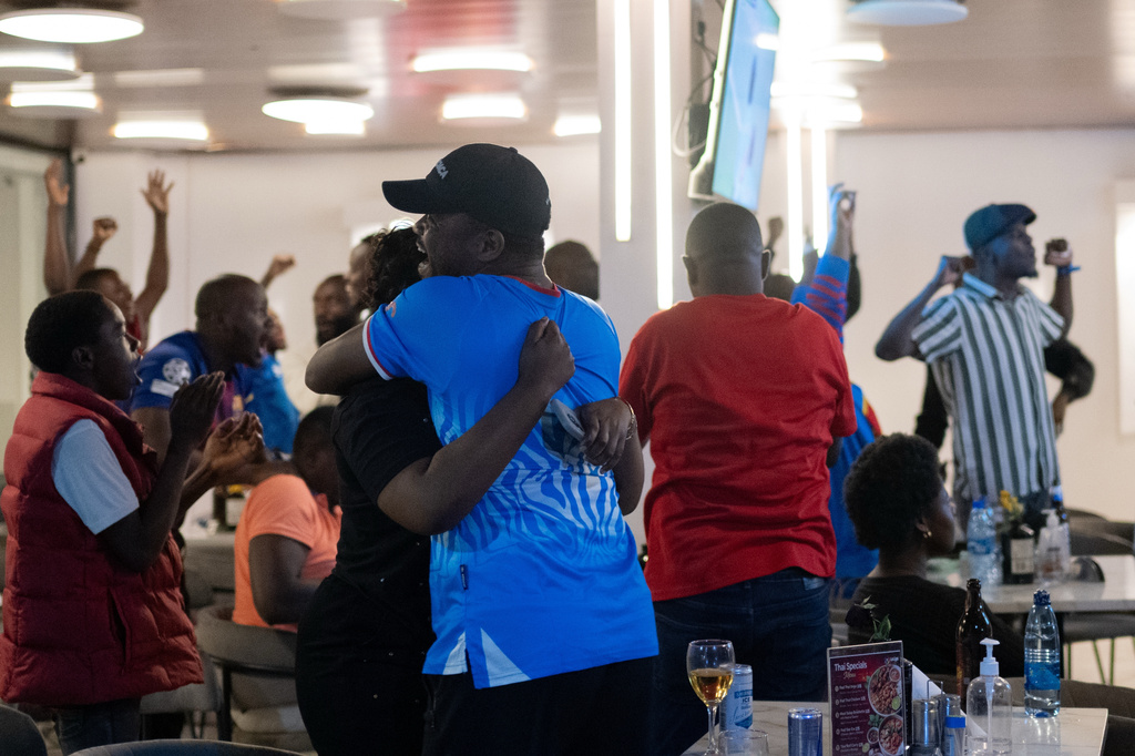 Congolese football fans celebrate in Goma, Democratic Republic of the Congo, as their team qualified for World Cup by winning over Jamaica in an intercontinental playoff, Wednesday, April 1, 2026.(AP Photo/Moses Sawasawa)