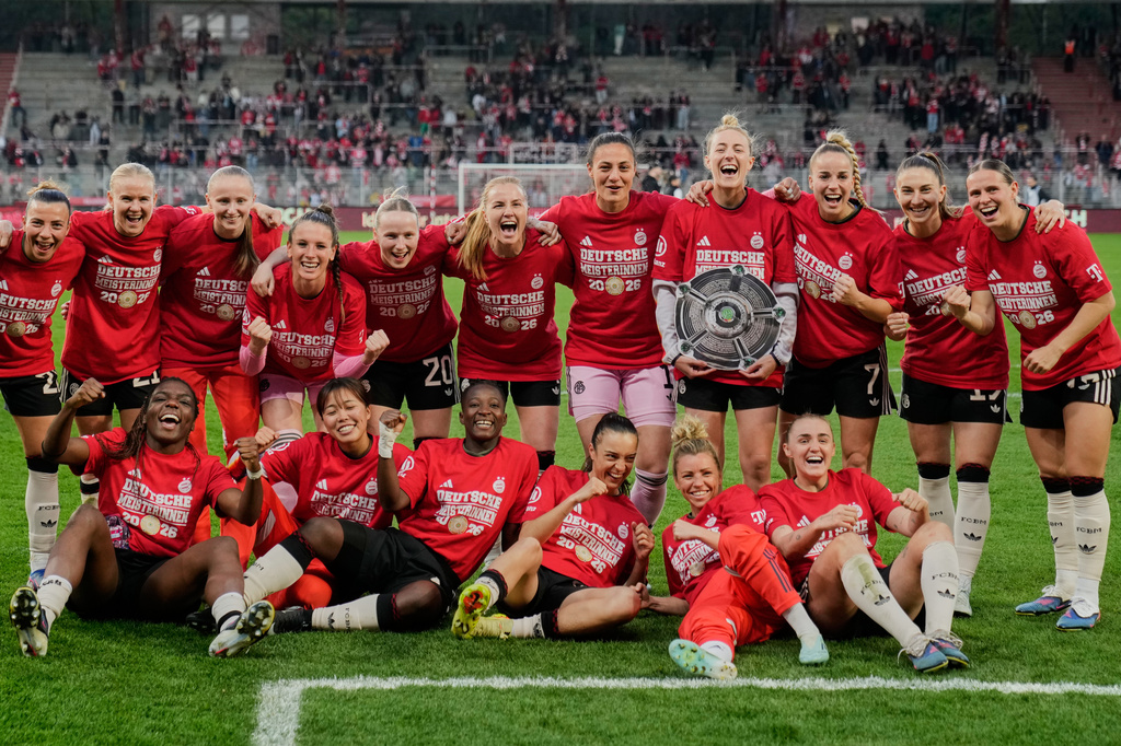 Munich players celebrate winning the German championship after a German women's Bundesliga soccer match between 1.FC Union Berlin and Bayern Munich in Berlin, Germany, Wednesday, April 22, 2026. (AP Photo/Ebrahim Noroozi)