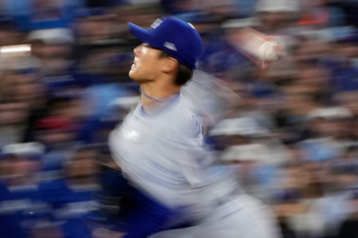 Los Angeles Dodgers pitcher Yoshinobu Yamamoto throws against the Toronto Blue Jays during the second inning in Game 2 of baseball's World Series, Saturday, Oct. 25, 2025, in Toronto. (AP Photo/Brynn Anderson) Los Angeles Dodgers pitcher Yoshinobu Yamamoto throws against the Toronto Blue Jays during the second inning in Game 2 of baseball's World Series, Saturday, Oct. 25, 2025, in Toronto. (AP Photo/Brynn Anderson)