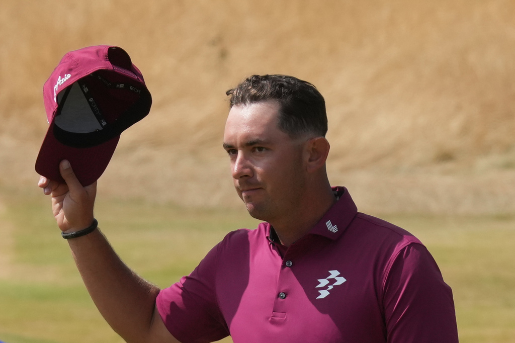 Lucas Herbert of Australia reacts to the crowd after he completed his second round on the 18th green during the second day of the British Open Golf championships at Royal Birkdale golf club, in Southport, England, Friday, July 17, 2026. (AP Photo/Jon Super)