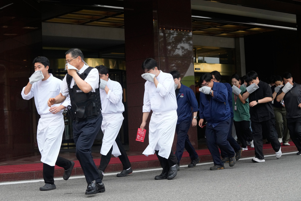 Staff members of a hotel take part in an anti-terror drill as a part of the Ulchi Freedom Shield military exercise between the U.S. and South Korea in Seoul, South Korea, Wednesday, Aug. 19, 2026. (AP Photo/Ahn Young-joon)