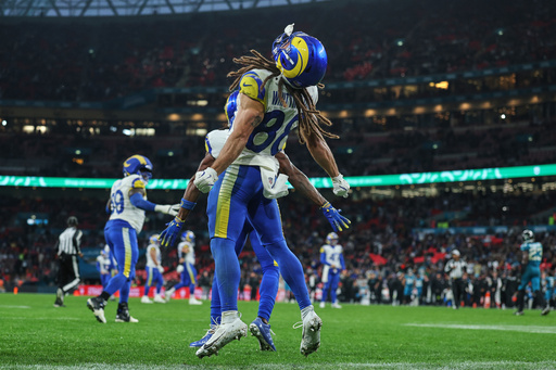 Los Angeles Rams wide receiver Jordan Whittington (88) celebrates after teammate wide receiver Davante Adams (17) scored a touchdown during the second half of an NFL football game between the Los Angeles Rams and the Jacksonville Jaguars in London, Sunday, Oct. 19, 2025. (AP Photo/Ian Walton) Los Angeles Rams wide receiver Jordan Whittington (88) celebrates after teammate wide receiver Davante Adams (17) scored a touchdown during the second half of an NFL football game between the Los Angeles Rams and the Jacksonville Jaguars in London, Sunday, Oct. 19, 2025. (AP Photo/Ian Walton)