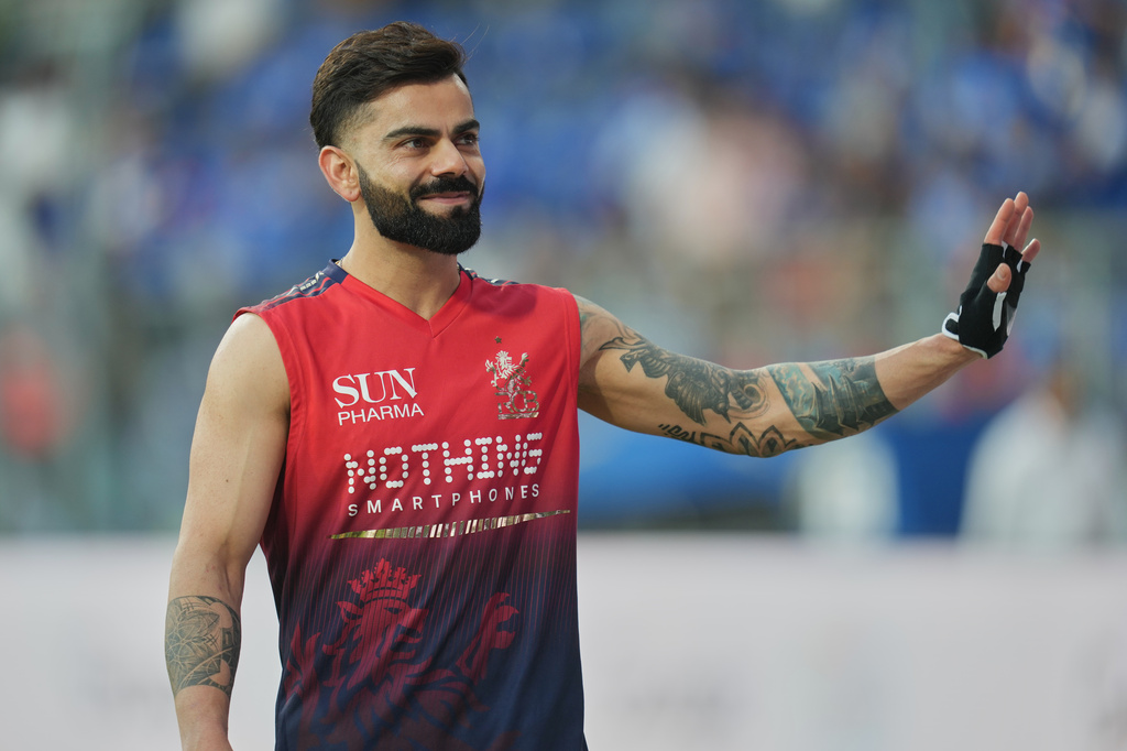 Royal Challengers Bengaluru's Virat Kohli waves to the crowd prior to start of the Indian Premier League cricket match between Mumbai Indians and Royal Challengers Bengaluru, in Guwahati, India, Sunday, April 12, 2026. (AP Photo/Rafiq Maqbool)