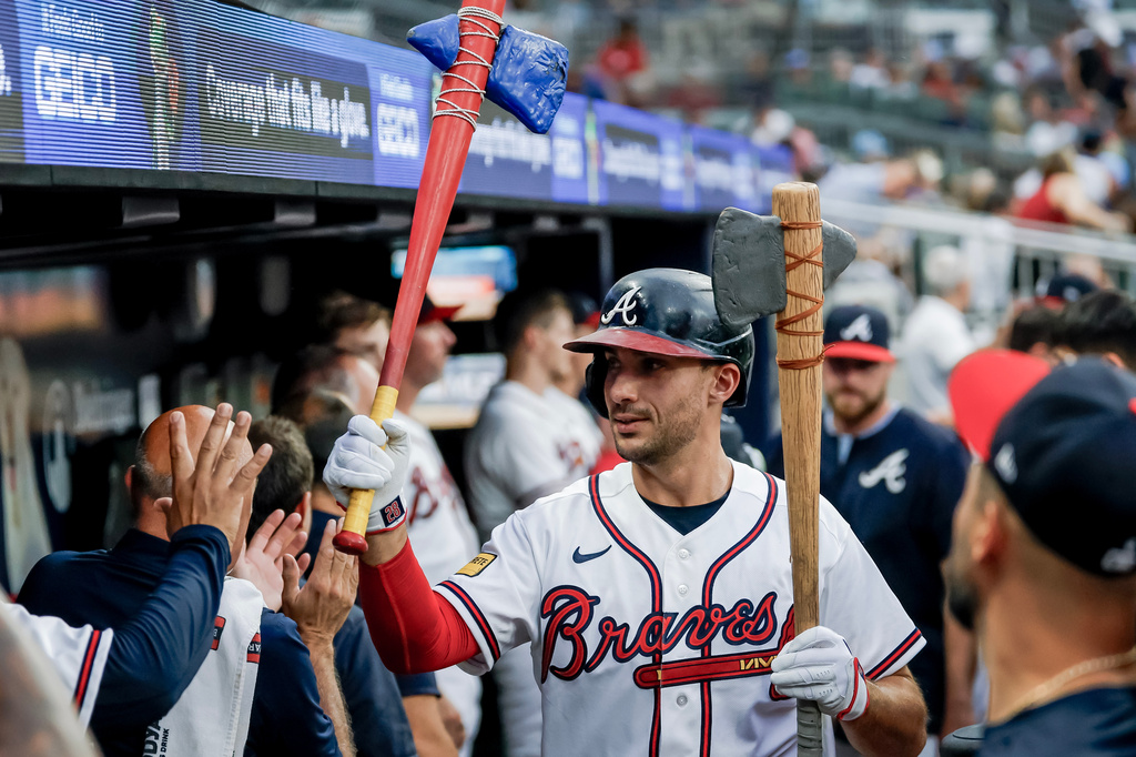 Atlanta Braves' Matt Olson celebrates in the dugout after hitting a solo home run against the Los Angeles Dodgers during the first inning of a baseball game, Wednesday, Aug. 26, 2026, in Atlanta. (AP Photo/Erik S. Lesser)