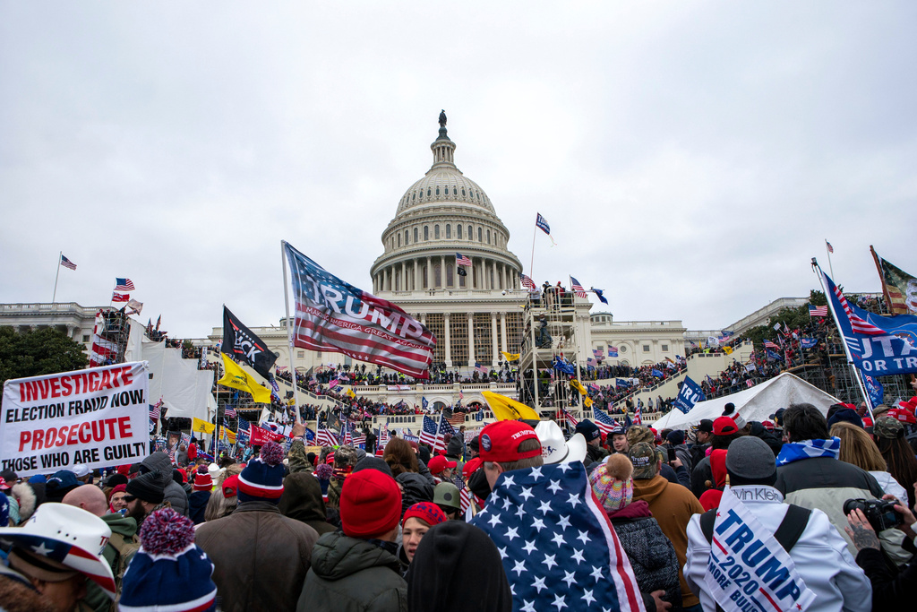 FILE - Rioters loyal to President Donald Trump rally at the U.S. Capitol in Washington on Jan. 6, 2021. (AP Photo/Jose Luis Magana, File)