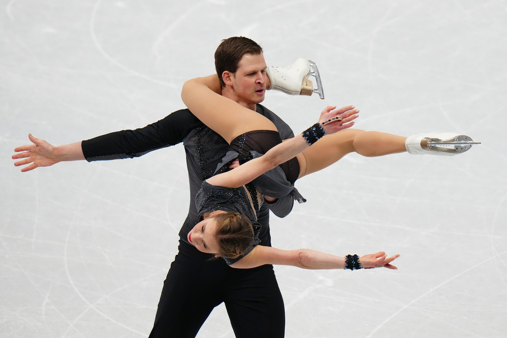 Alisa Efimova and Misha Mitrofanov, of United States compete in the Pairs Short Program at the ISU Four Continents Figure Skating Championships, in Beijing, China, Thursday, Jan. 22, 2026. (AP Photo/Andy Wong)