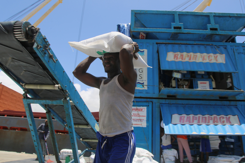 Workers load cargo at the port in Mogadishu, Somalia, Sunday, Sept. 13, 2026. (AP Photo/Farah Abdi Warsameh)