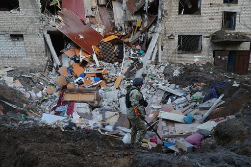 Emergency personnel examine the site of an airstrike after a Russian missile hit a hostel in Zaporizhzhia, Ukraine, Thursday, Oct. 30, 2025. (AP Photo/Kateryna Klochko) Emergency personnel examine the site of an airstrike after a Russian missile hit a hostel in Zaporizhzhia, Ukraine, Thursday, Oct. 30, 2025. (AP Photo/Kateryna Klochko)
