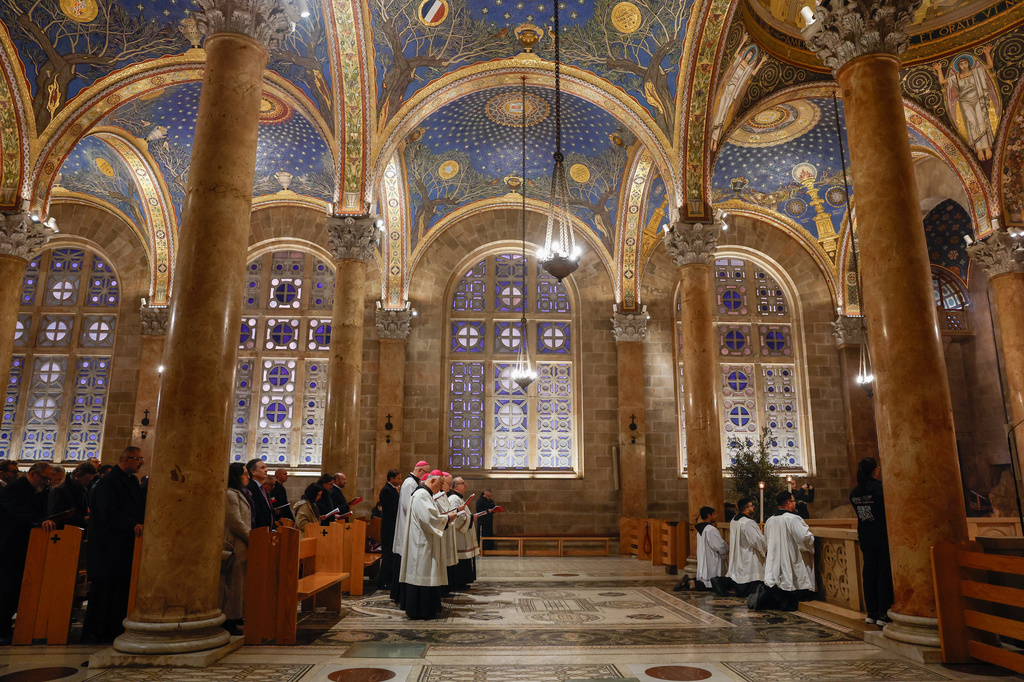 Faithful attend a prayer service in the Church of All Nations, held by Cardinal Pierbattista Pizzaballa, the Latin Patriarch of Jerusalem, to mark Palm Sunday in Jerusalem, Sunday, March 29, 2026. (Ammar Awad/Pool Photo via AP)